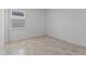 Simple bedroom with tile floors and a window with blinds at 2896 Lingo Ln, Orlando, FL 32822