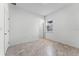 Empty bedroom with tile floors and an exterior door at 2896 Lingo Ln, Orlando, FL 32822