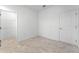 Well-lit bedroom with tile floors and a walk-in closet at 2896 Lingo Ln, Orlando, FL 32822