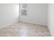 Bright bedroom featuring tile floors and a window at 2896 Lingo Ln, Orlando, FL 32822