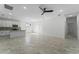 Open kitchen with island, granite countertops, stainless steel appliances, and white cabinets at 2896 Lingo Ln, Orlando, FL 32822