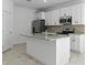 Modern kitchen featuring granite countertops and stainless steel appliances at 2896 Lingo Ln, Orlando, FL 32822