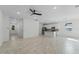 Open-concept living room with tile flooring and modern kitchen at 2896 Lingo Ln, Orlando, FL 32822
