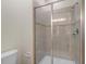 Shower stall with glass enclosure and tile surround at 3071 Beach Palm Ave, Kissimmee, FL 34747