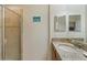 Bathroom with granite countertop, shower and a single sink vanity at 3071 Beach Palm Ave, Kissimmee, FL 34747