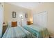 Bedroom with twin beds, striped bedding, and closet at 3071 Beach Palm Ave, Kissimmee, FL 34747