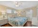 Spacious bedroom with king-size bed and light blue bedding at 3071 Beach Palm Ave, Kissimmee, FL 34747