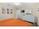 Main bedroom with king bed, dresser, and flat-screen TV at 3071 Beach Palm Ave, Kissimmee, FL 34747