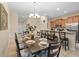 Dining room with a large table and chairs, kitchen access at 3071 Beach Palm Ave, Kissimmee, FL 34747