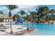 Resort-style pool with waterslide and lounge chairs at 3071 Beach Palm Ave, Kissimmee, FL 34747