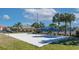 Sand volleyball court with a net and surrounding area at 3071 Beach Palm Ave, Kissimmee, FL 34747