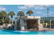 Serene waterfall feature next to the pool at 3071 Beach Palm Ave, Kissimmee, FL 34747