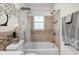 This bathroom is the perfect blend of design and practicality with decorative accents and a shower-tub combo at 3104 Harrison Ave # 11, Orlando, FL 32804