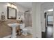 This bathroom offers a pedestal sink and a shower-tub combo, perfect for relaxation and convenience at 3104 Harrison Ave # 11, Orlando, FL 32804