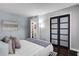This cozy bedroom features modern closet doors and minimalist decor to help you relax and unwind at 3104 Harrison Ave # 11, Orlando, FL 32804