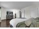 Relax in this bedroom with an accent wall, a modern dresser, and lots of natural light at 3104 Harrison Ave # 11, Orlando, FL 32804
