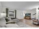 Bright living room with modern decor, a large sectional, and hardwood floors at 3104 Harrison Ave # 11, Orlando, FL 32804