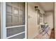 Inviting porch with tile floor, seating, and view through a screen door at 3104 Harrison Ave # 11, Orlando, FL 32804