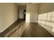 Spacious bedroom with wood-look floors and view of hallway and bathroom at 3621 Conroy Rd # 730, Orlando, FL 32839