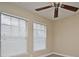 Bright bedroom with ceiling fan and neutral walls at 4220 Messina Dr, Lake Mary, FL 32746