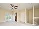 Bright bedroom with ceiling fan, private access to the bathroom, and balcony access at 4220 Messina Dr, Lake Mary, FL 32746