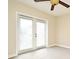 Bright bedroom with double doors leading to exterior at 4220 Messina Dr, Lake Mary, FL 32746