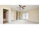 Bedroom with ceiling fan, access to bathroom, and private balcony at 4220 Messina Dr, Lake Mary, FL 32746