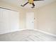 Spacious bedroom with ceiling fan and double door closet at 4220 Messina Dr, Lake Mary, FL 32746