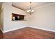 Dining room with hardwood floors and kitchen pass-through at 4220 Messina Dr, Lake Mary, FL 32746