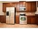 Kitchen with stainless steel appliances and wood cabinets at 4220 Messina Dr, Lake Mary, FL 32746