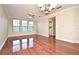 Bright living room with hardwood floors and large windows at 4220 Messina Dr, Lake Mary, FL 32746