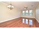 Bright living room with hardwood floors and large windows at 4220 Messina Dr, Lake Mary, FL 32746