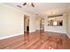 Hardwood floor living room, view of kitchen and stairs at 4220 Messina Dr, Lake Mary, FL 32746