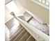 Bright, carpeted staircase with white railing at 4220 Messina Dr, Lake Mary, FL 32746