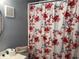 The bathroom has a Paris-themed shower curtain at 4709 Almond Willow Dr, Orlando, FL 32808