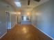 Bright living room showcasing hardwood floors, a ceiling fan, and a large skylight at 4709 Almond Willow Dr, Orlando, FL 32808