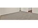 Large bedroom with plush carpeting and access to hallway at 5531 Hayloft Dr, Apopka, FL 32712