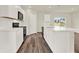 Modern kitchen with white cabinets, stainless steel appliances and an island at 5531 Hayloft Dr, Apopka, FL 32712