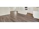 Modern kitchen with white cabinets, island, and stainless steel appliances at 5531 Hayloft Dr, Apopka, FL 32712