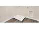 Laundry room with built-in shelving and drain at 5531 Hayloft Dr, Apopka, FL 32712