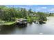 Aerial view of property showcasing private dock and lush landscape at 5800 N Dean Rd, Orlando, FL 32817