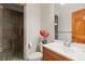 Updated bathroom features a walk-in shower and wood vanity at 5800 N Dean Rd, Orlando, FL 32817