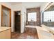 Elegant bathroom with soaking tub, walk-in shower, and tile flooring at 5800 N Dean Rd, Orlando, FL 32817