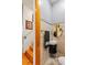 Small half bathroom with round mirror at 5800 N Dean Rd, Orlando, FL 32817