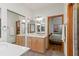 Spacious bathroom with double sinks and a view of the bedroom at 5800 N Dean Rd, Orlando, FL 32817