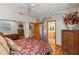 Bedroom with hardwood floors, mural, and ensuite bathroom at 5800 N Dean Rd, Orlando, FL 32817