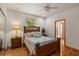 Charming bedroom with wooden floors and a comfortable bed at 5800 N Dean Rd, Orlando, FL 32817