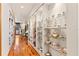 Long hallway with built-in glass display shelves at 5800 N Dean Rd, Orlando, FL 32817