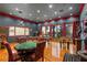 Game room boasts a pool table, foosball, and poker table at 5800 N Dean Rd, Orlando, FL 32817