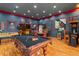 Spacious game room includes a pool table and other games at 5800 N Dean Rd, Orlando, FL 32817
